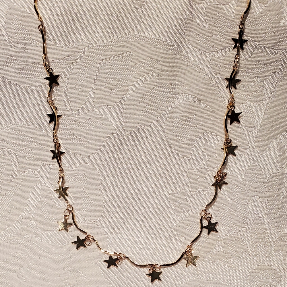 Gold multi star necklace